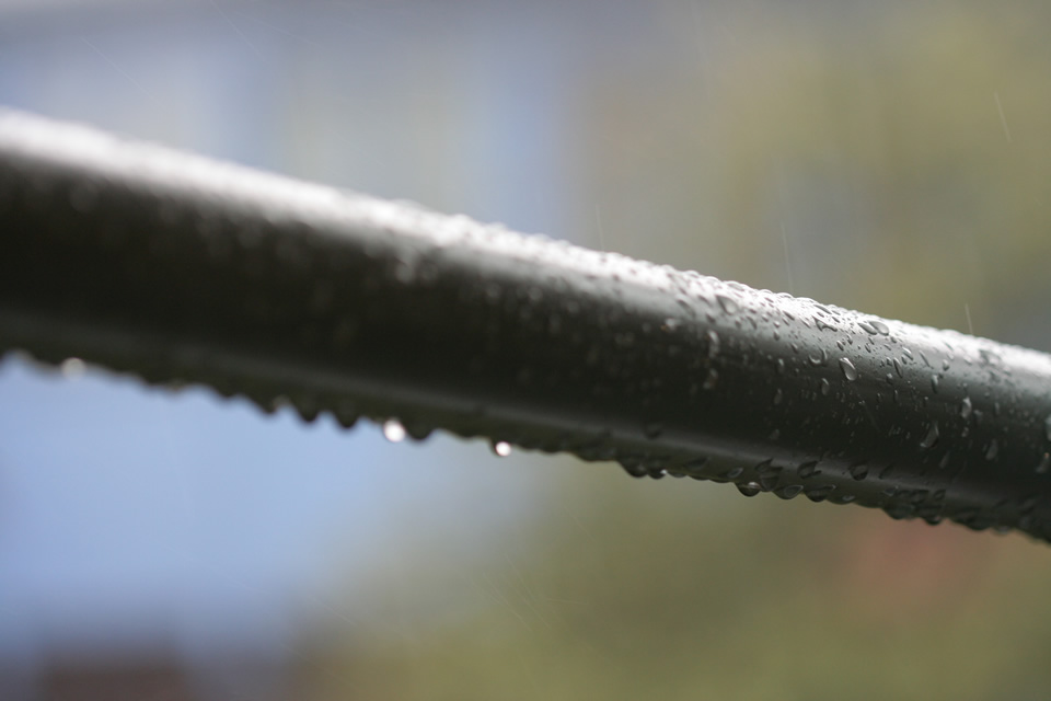 Rain on a metal bar