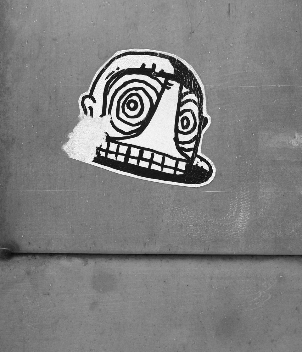Torn sticker of a face