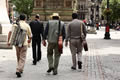 Musicians walking through Albert Square, Manchester